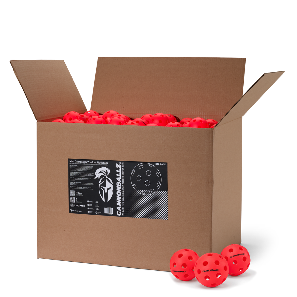 Open 300-pack cardboard box filled with red Cannonballz indoor pickleball balls with 26-hole design.