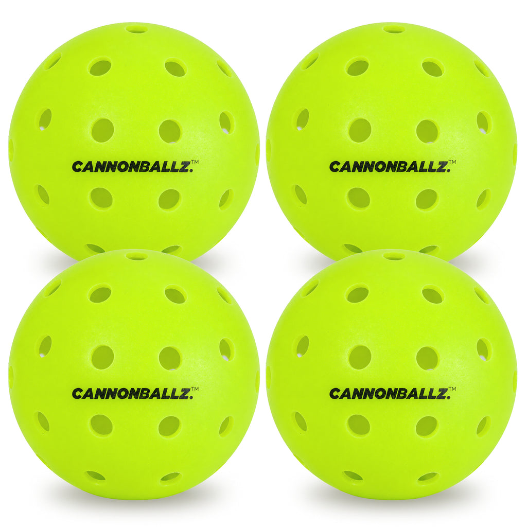 Four bright green outdoor Cannonballz balls on a white background
