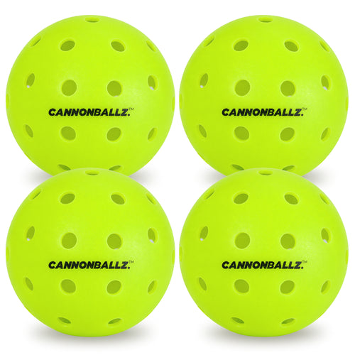 Four bright green outdoor Cannonballz balls on a white background