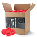 Four red Cannonballz indoor pickleball balls with 26-hole design displayed beneath their 100-pack cardboard box.