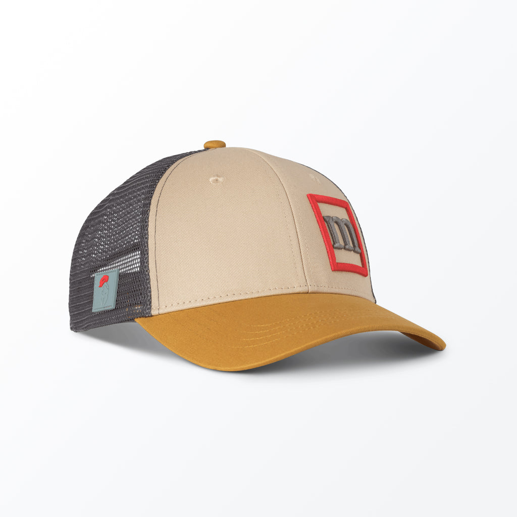 A beige and gray trucker hat with a mesh back and a 3D embroidered logo on the front.