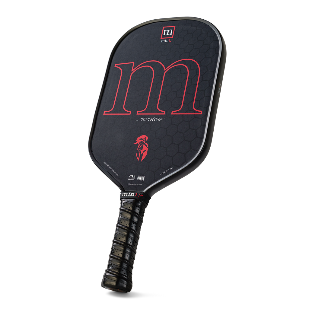 Black pickleball paddle with red letter 'm' on a white background