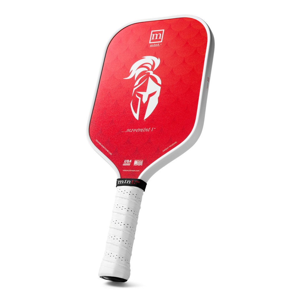 Red pickleball paddle with white handle on a white background