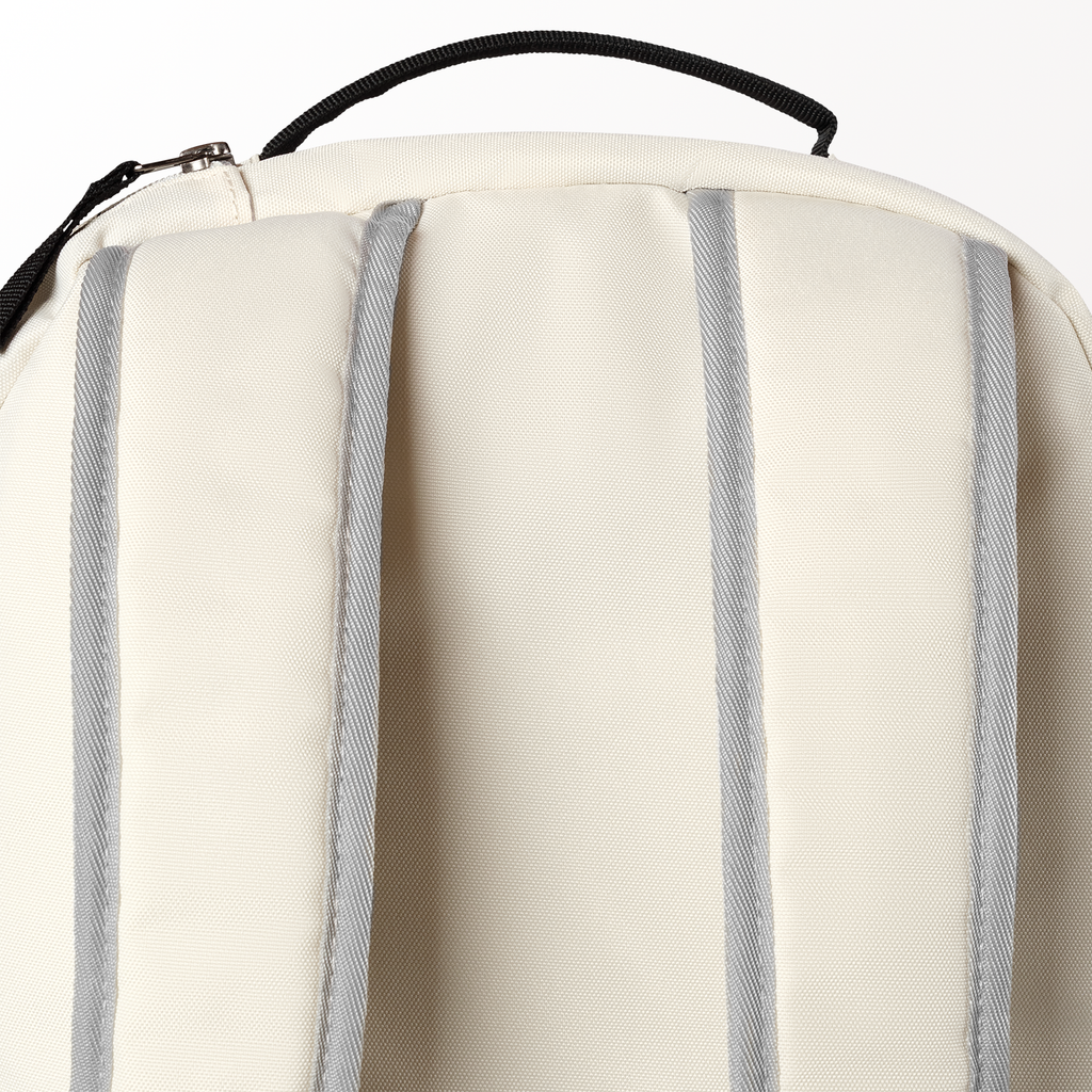 Close-up of a beige backpack with gray straps on a white background
