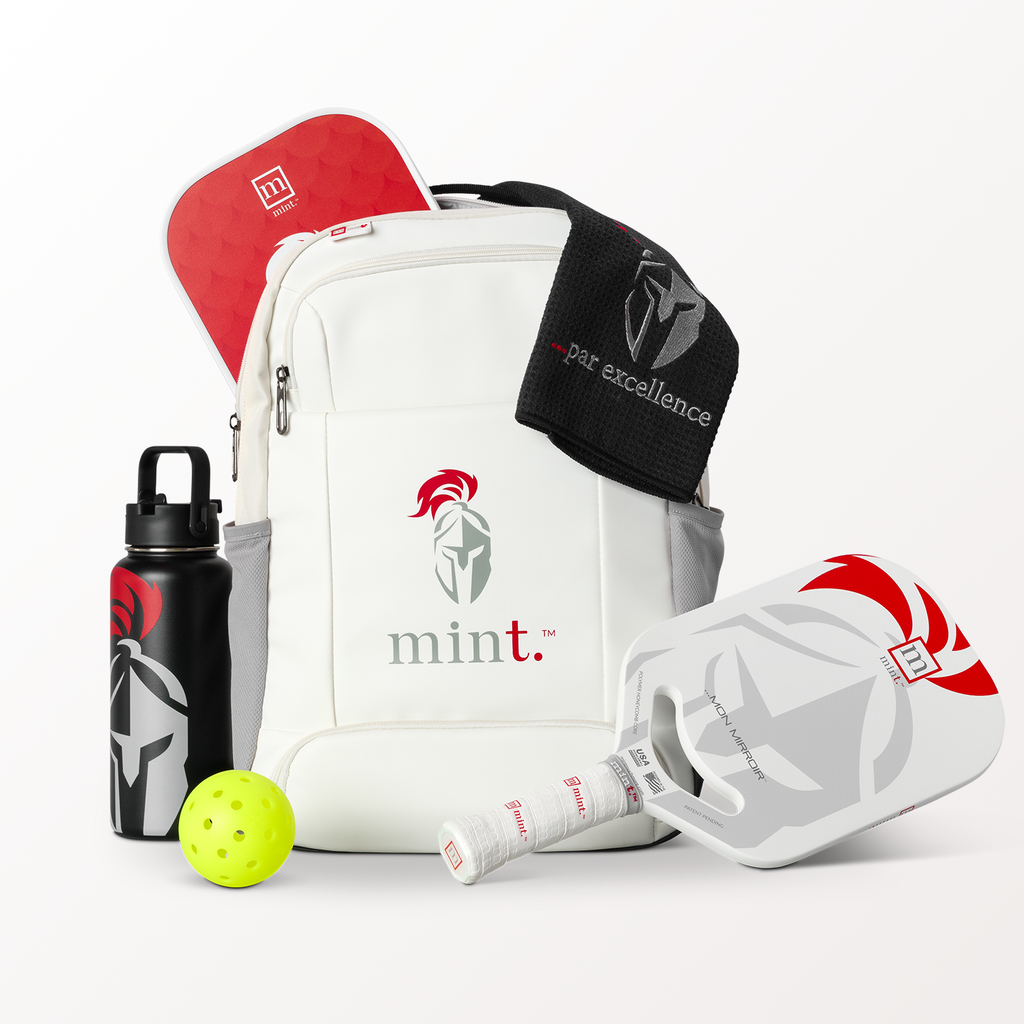 Pickleball paddles, ball, and accessories with 'mint.' branding on a white background