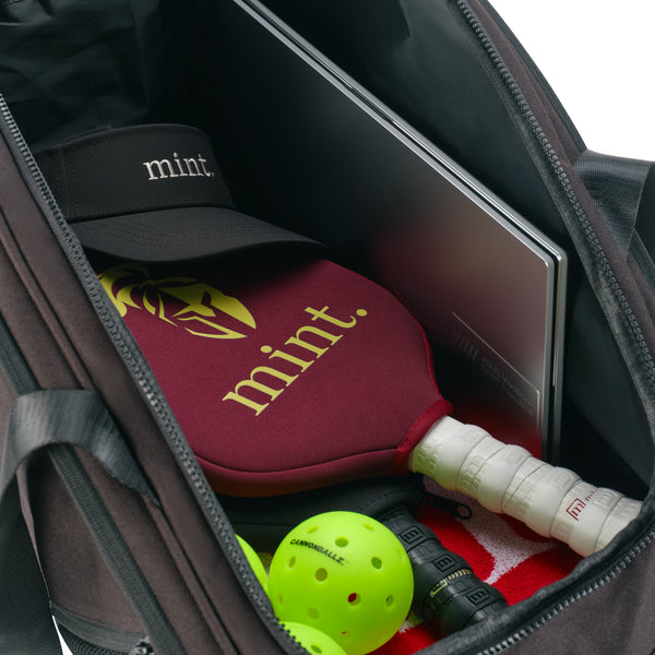 Unleash Tournament Bag in Black, main compartment packed with gear