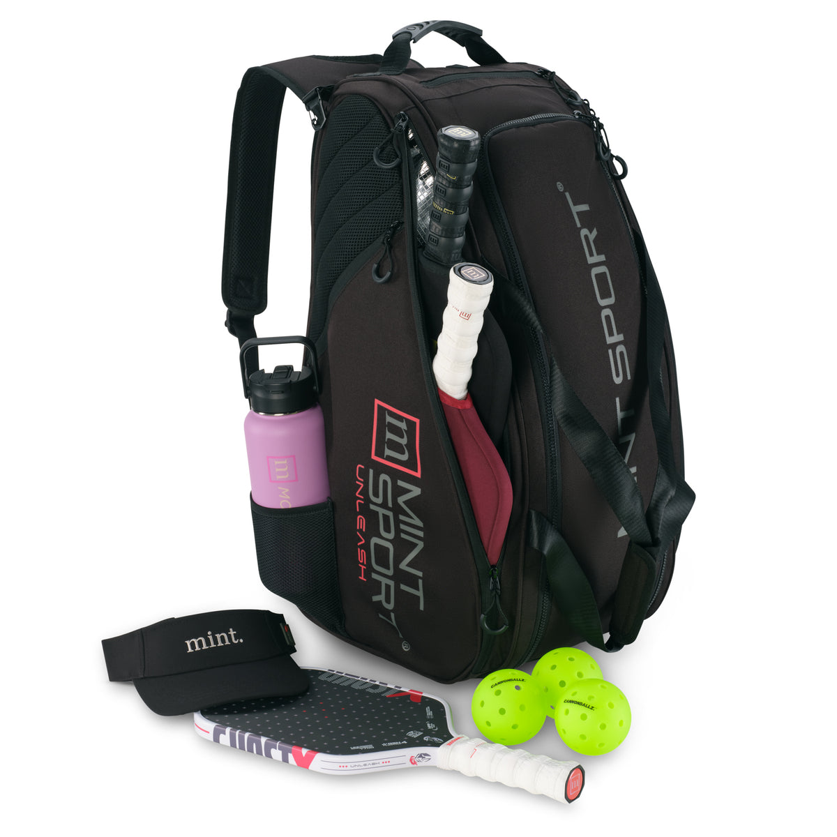Unleash Tournament Bag in Black, packed for pickleball with paddles, pickleballs and a water bottle