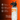 White water bottle with orange design on an orange background, featuring text and icons about the bottle's features.