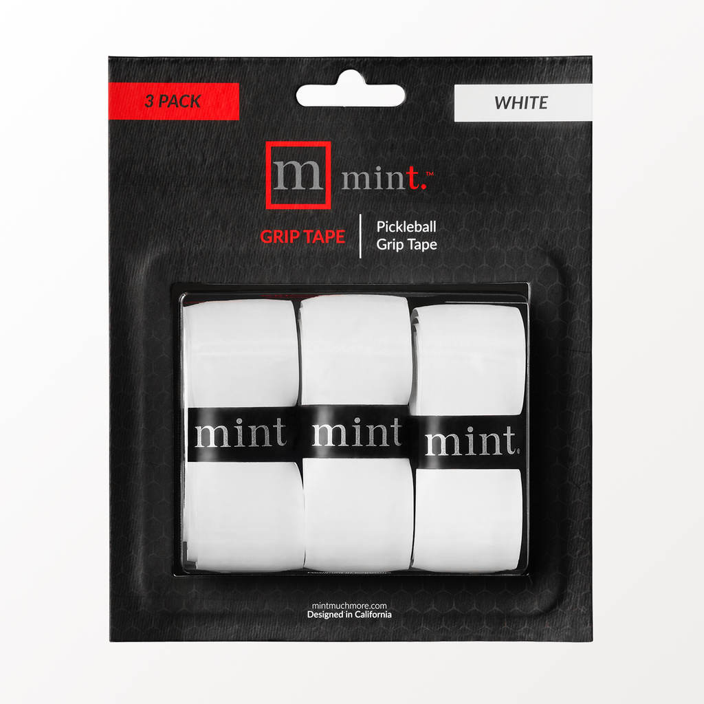 Pack of white pickleball grip tape with 'mint' branding on a black background
