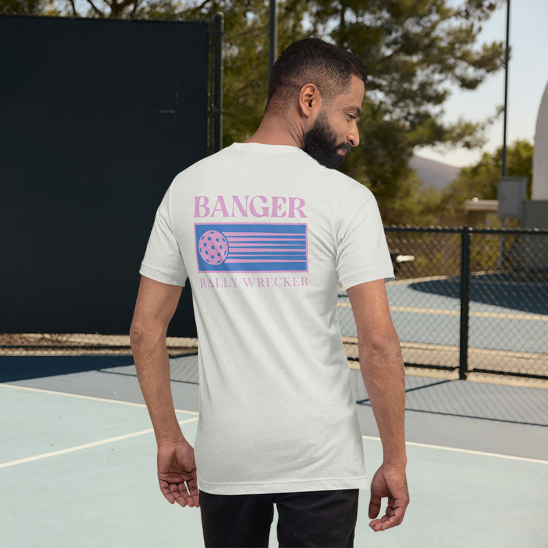 Man wearing a white t-shirt with 'Banger Rally Wrecker' design on a tennis court