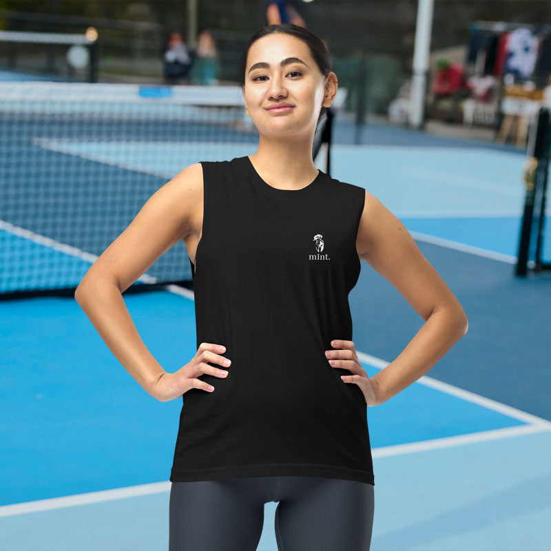 Woman wearing a black sleeveless shirt with a logo on a tennis court
