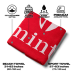 Red towel with product feature graphics on a white background.